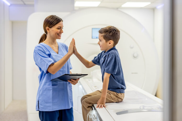 Friendly Healthcare Professional Interacting with a Child in a Medical Facility